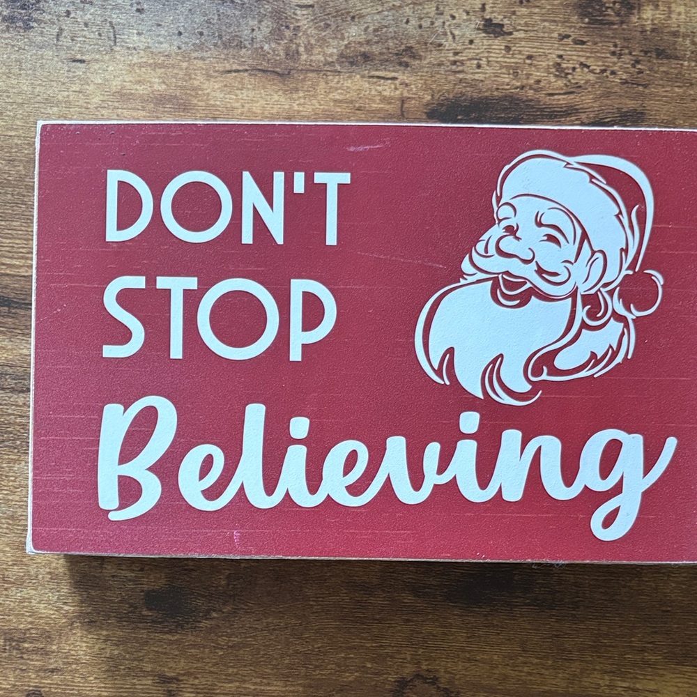 Festive Red Holiday Sign with Santa Design